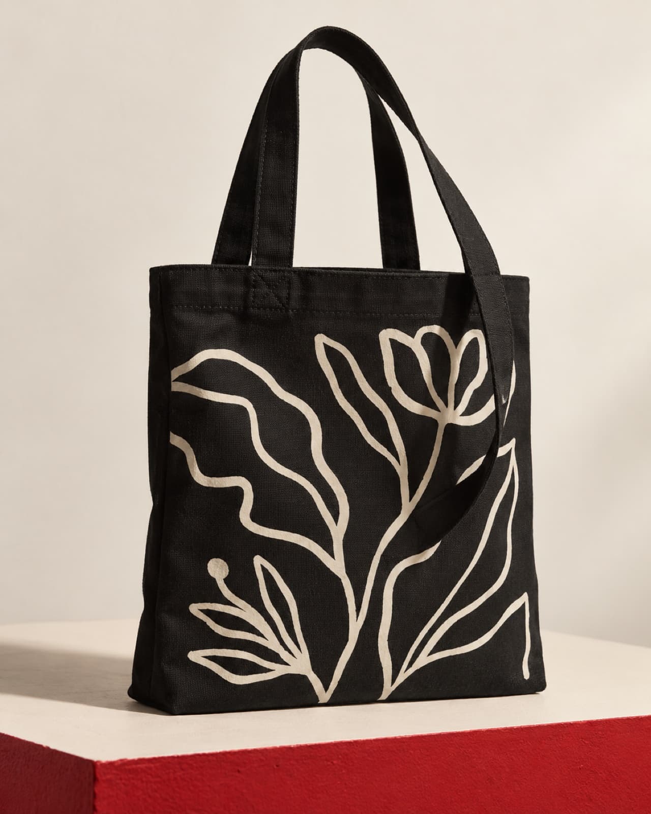 Black cotton tote customised with an off-white botanical line print